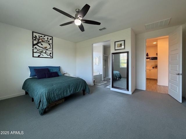 2727 N Acacia Way, Buckeye, AZ 85396 - bedroom featuring carpet, ensuite bathroom, baseboards, and a ceiling fan