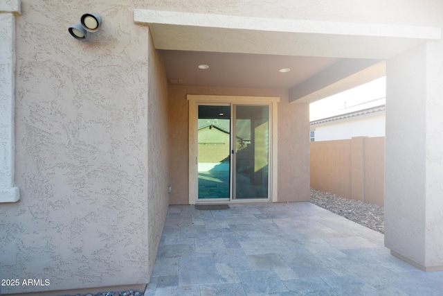 2727 N Acacia Way, Buckeye, AZ 85396 - property entrance with a patio, stucco siding, and fence