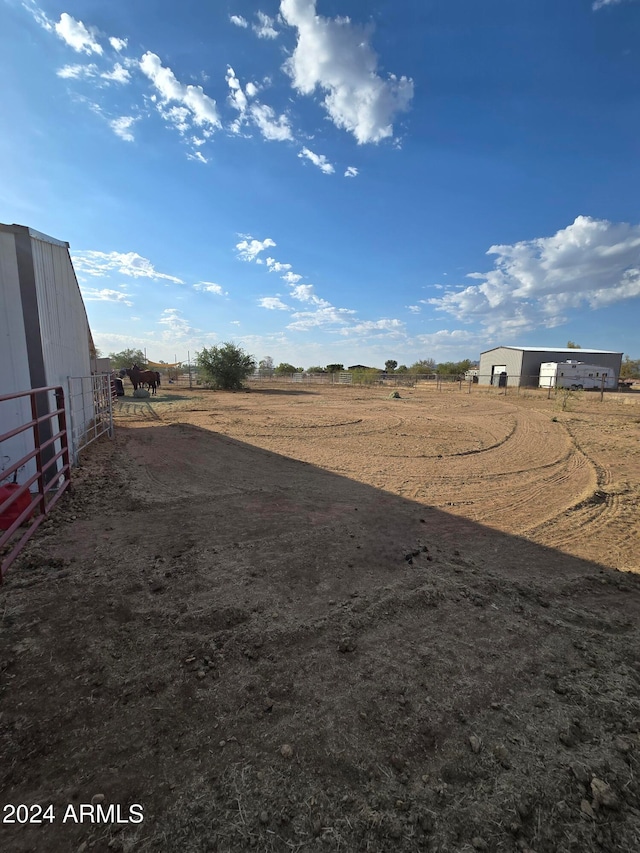 view of yard with a rural view