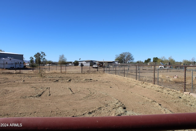 view of yard with a rural view