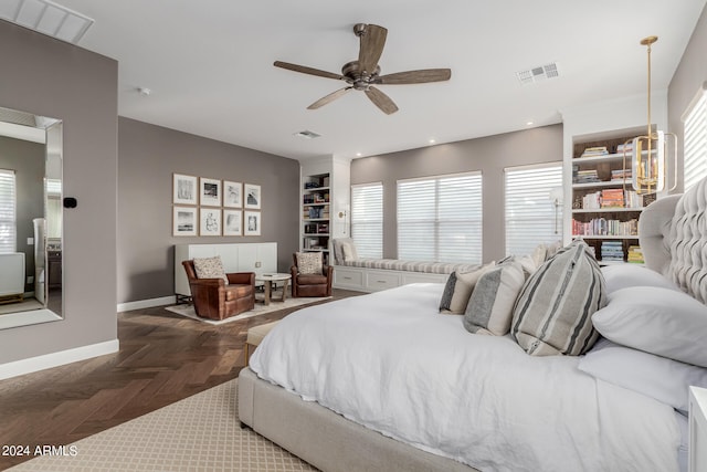 bedroom with dark parquet floors and ceiling fan