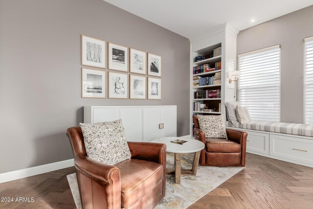 living area featuring light parquet floors