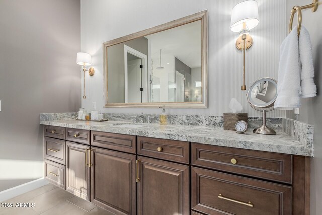 bathroom with tile patterned flooring and vanity