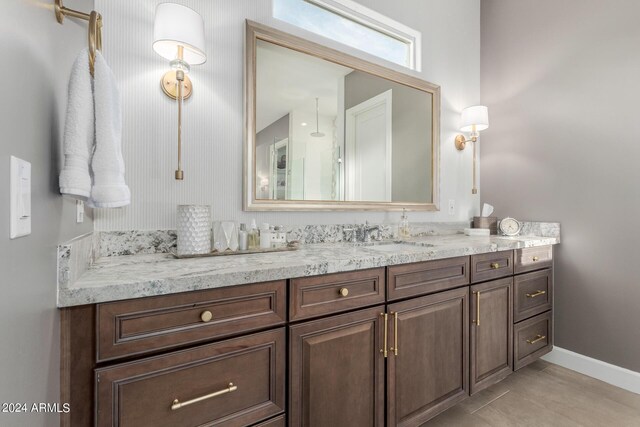 bathroom with tile patterned floors and vanity