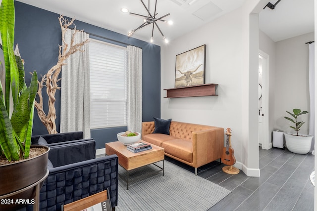 living room featuring dark hardwood / wood-style flooring and a notable chandelier