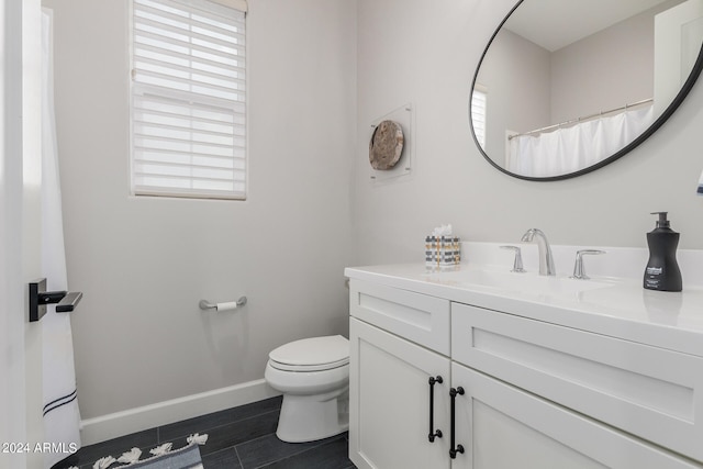 bathroom featuring vanity, toilet, and wood-type flooring