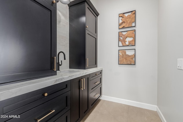 bathroom featuring tile patterned flooring and vanity