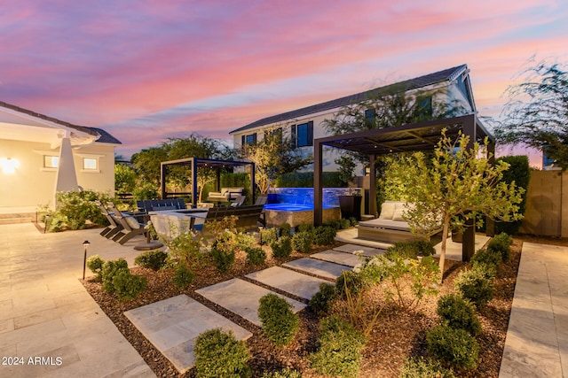 patio terrace at dusk with a pergola, area for grilling, and a swimming pool