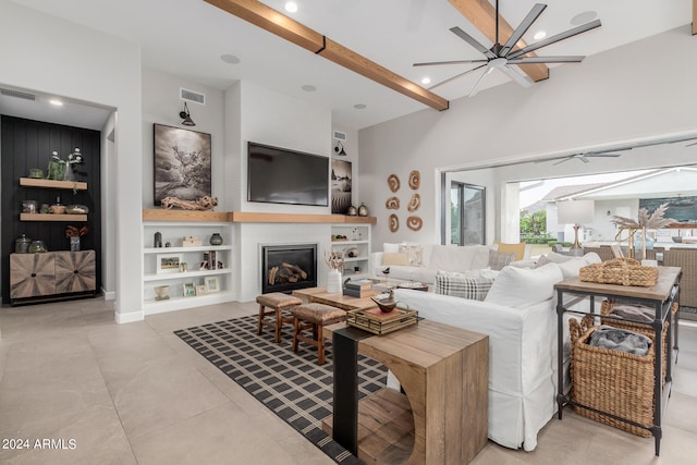 tiled living room featuring beam ceiling