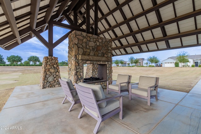 view of patio with an outdoor stone fireplace