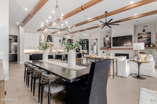 tiled dining space featuring ceiling fan with notable chandelier and beam ceiling