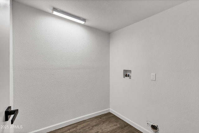 washroom featuring laundry area, washer hookup, dark wood finished floors, and baseboards