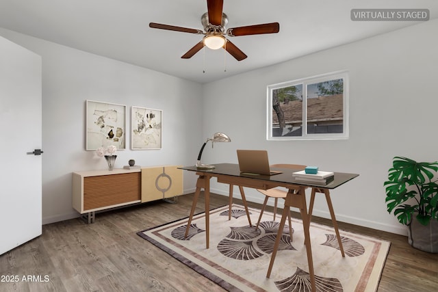 home office with ceiling fan, baseboards, and wood finished floors