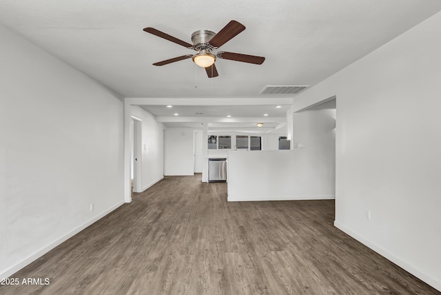 unfurnished living room featuring recessed lighting, wood finished floors, visible vents, and baseboards