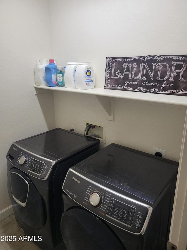 laundry area featuring washer and dryer and laundry area