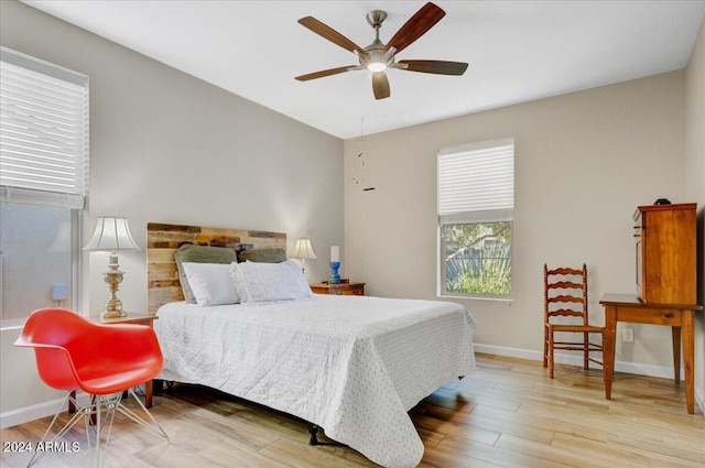 bedroom featuring ceiling fan and light hardwood / wood-style floors