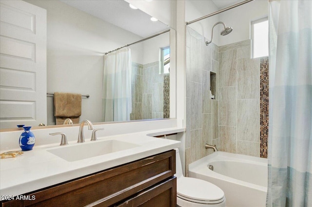 full bathroom with vanity, toilet, and shower / tub combo