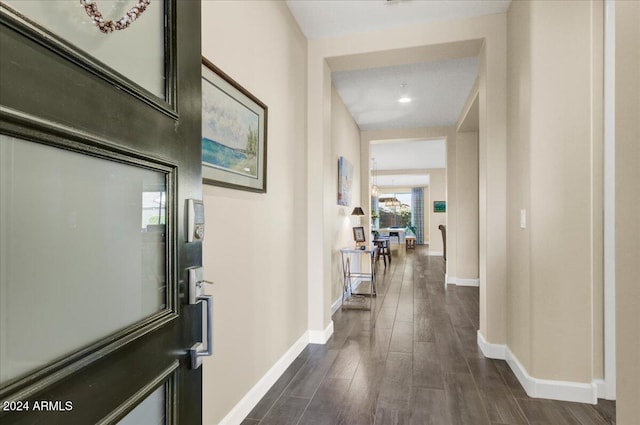 hall with dark wood-type flooring