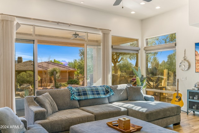 sunroom / solarium with ceiling fan and plenty of natural light