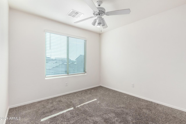 spare room with carpet and ceiling fan