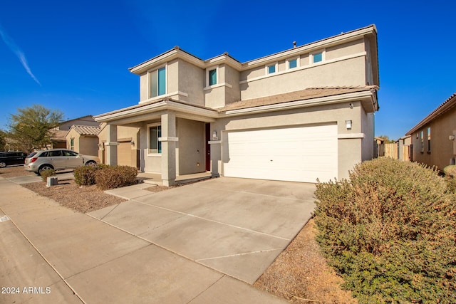 view of front of property with a garage