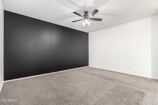 spare room with carpet flooring and ceiling fan