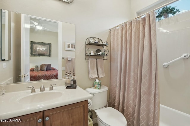 full bathroom featuring vanity, ceiling fan, shower / bath combo, and toilet