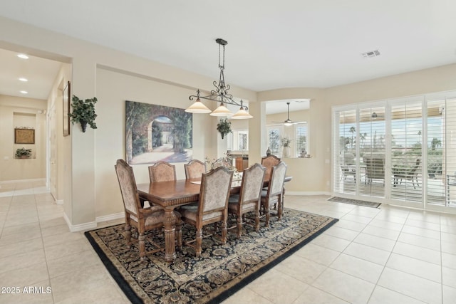 dining area featuring ceiling fan and light tile patterned floors