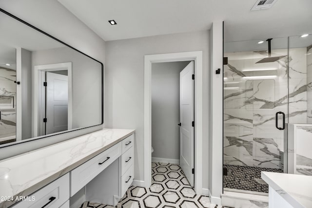 bathroom with vanity, toilet, and walk in shower