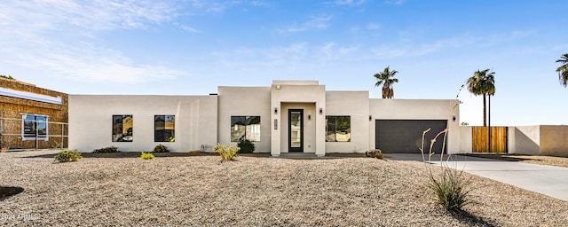 southwest-style home featuring a garage