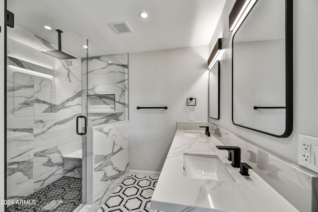 bathroom featuring vanity and an enclosed shower