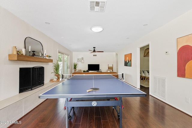 5912 E Wethersfield Rd, Scottsdale, AZ 85254 - rec room featuring a fireplace, wood finished floors, and ceiling fan