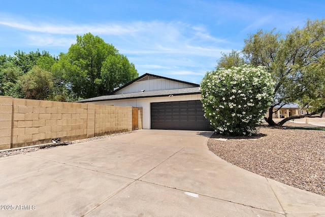 5912 E Wethersfield Rd, Scottsdale, AZ 85254 - view of home's exterior with concrete driveway and an attached garage