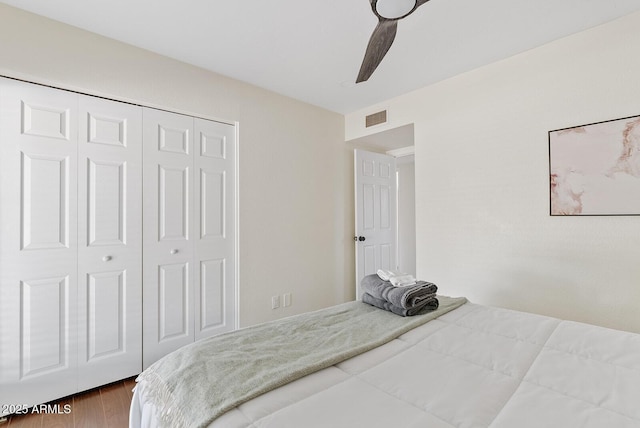 5912 E Wethersfield Rd, Scottsdale, AZ 85254 - bedroom with a closet, a ceiling fan, and wood finished floors