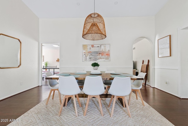 5912 E Wethersfield Rd, Scottsdale, AZ 85254 - dining space featuring wood finished floors and arched walkways