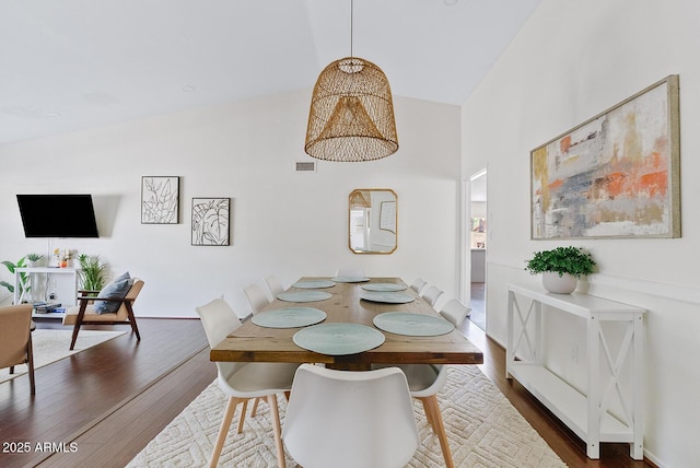 5912 E Wethersfield Rd, Scottsdale, AZ 85254 - dining area with dark wood-style flooring and high vaulted ceiling