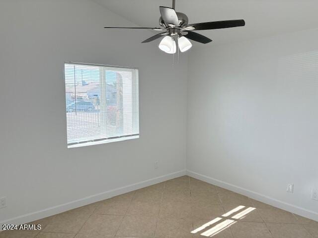 tiled empty room with ceiling fan