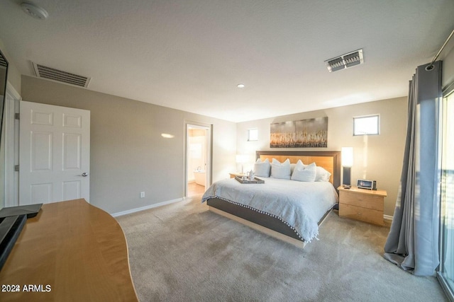 carpeted bedroom featuring connected bathroom