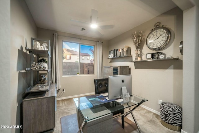 home office with ceiling fan and light colored carpet