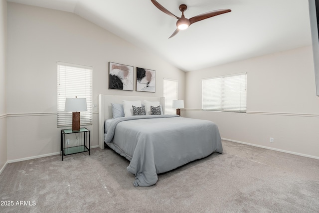 bedroom with lofted ceiling, carpet flooring, baseboards, and a ceiling fan