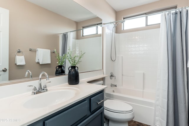 full bathroom featuring shower / bathtub combination with curtain, vanity, and toilet
