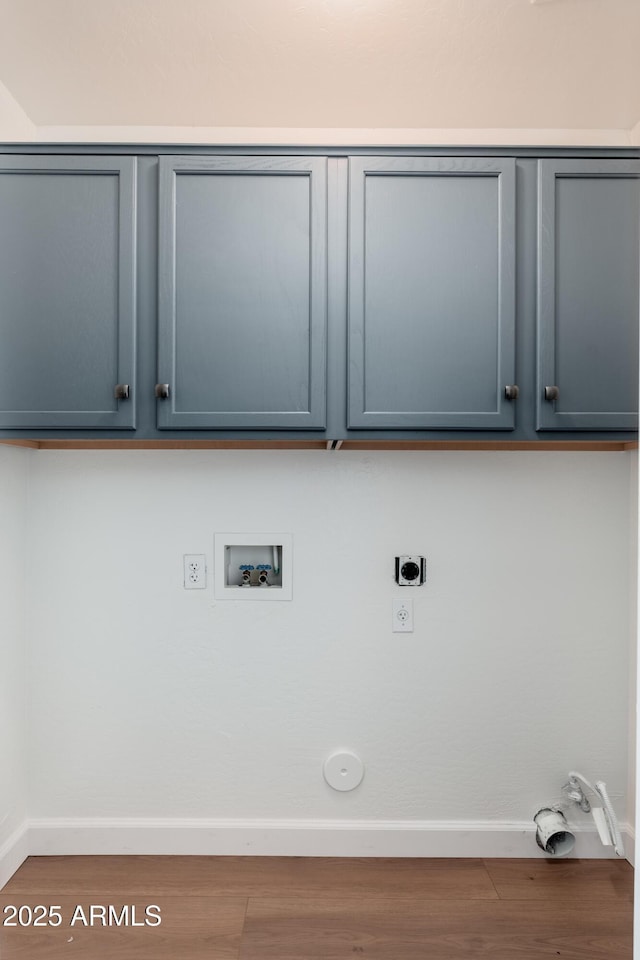 laundry room featuring hookup for an electric dryer, cabinet space, hookup for a washing machine, and baseboards
