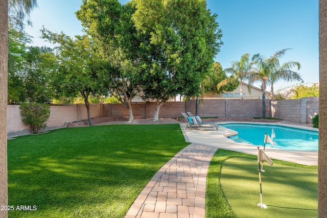 view of pool with a putting area and a patio