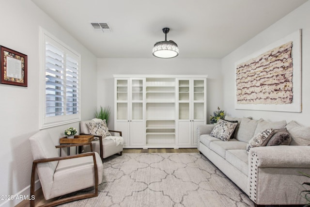 living room with light hardwood / wood-style flooring