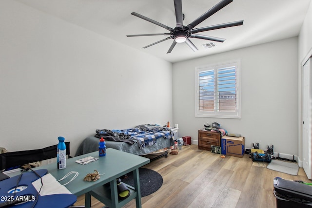 bedroom featuring ceiling fan and light hardwood / wood-style floors