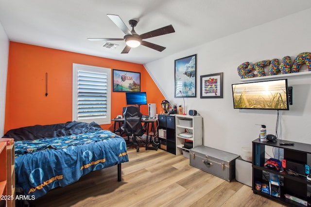 bedroom featuring vaulted ceiling, ceiling fan, and light hardwood / wood-style floors