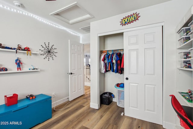 interior space featuring dark wood-type flooring and a closet