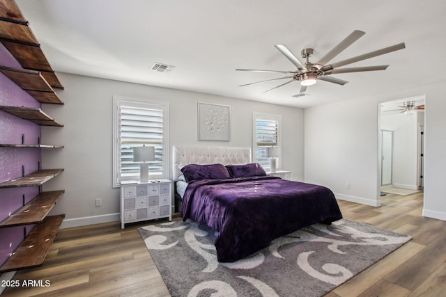 bedroom featuring dark wood-type flooring and ceiling fan