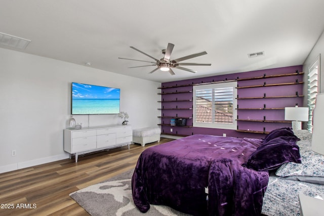 bedroom featuring ceiling fan and wood-type flooring