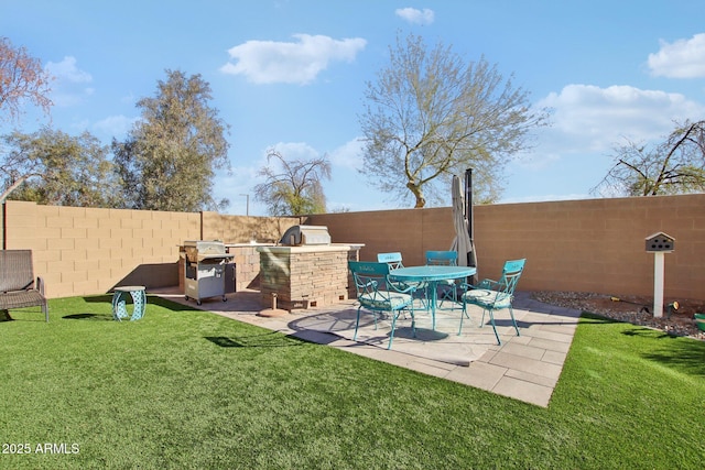 view of patio featuring exterior kitchen